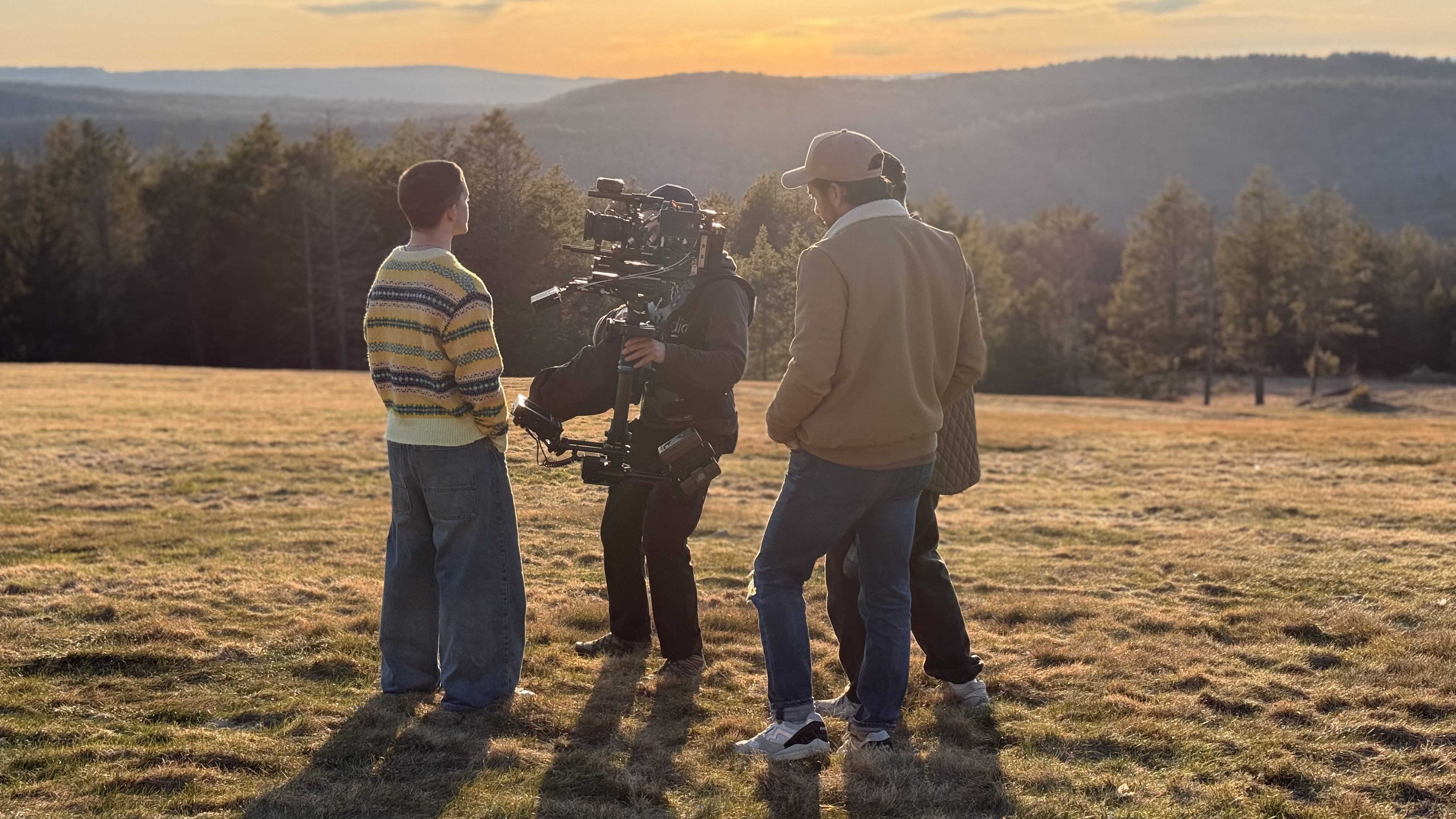 Golden hour over the 40-year land art installation in central Massachusetts — cleared forest creating a vast open vista