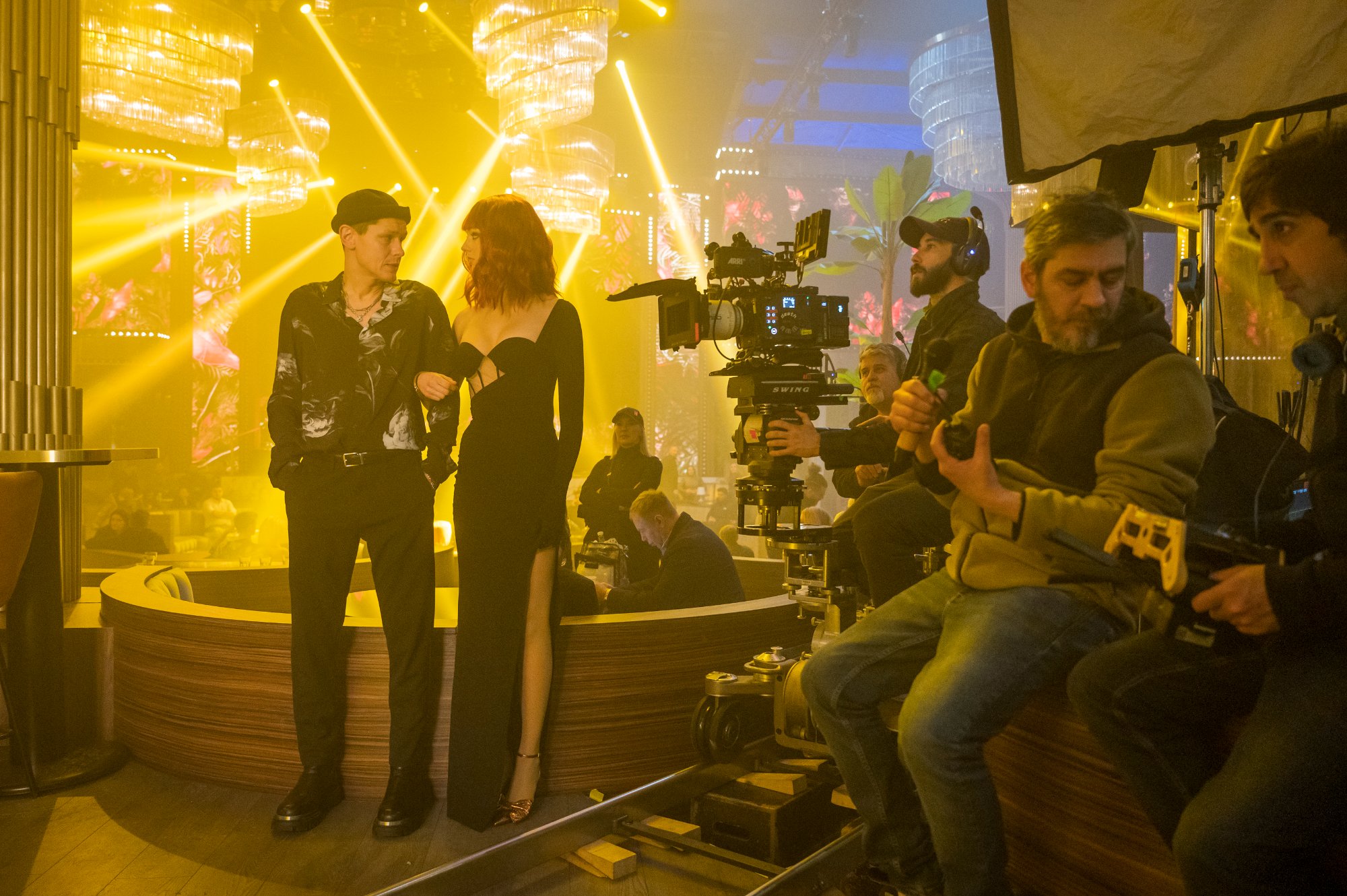 Behind the scenes in the club — ARRI Alexa 35 on dolly, Connor Storrie and Lilly Krug on stage, amber moving heads