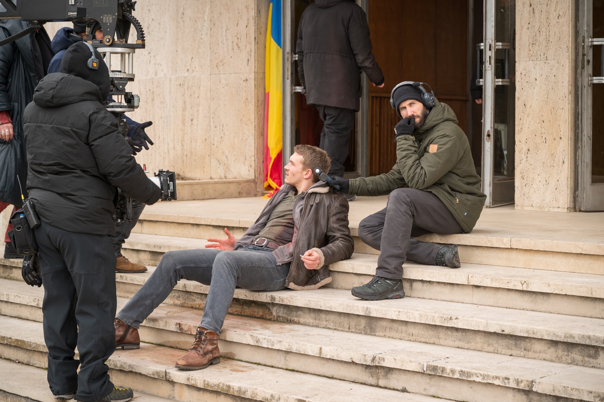 Nathan Haugaard and Connor Storrie on the marble steps of a government building in Bucharest