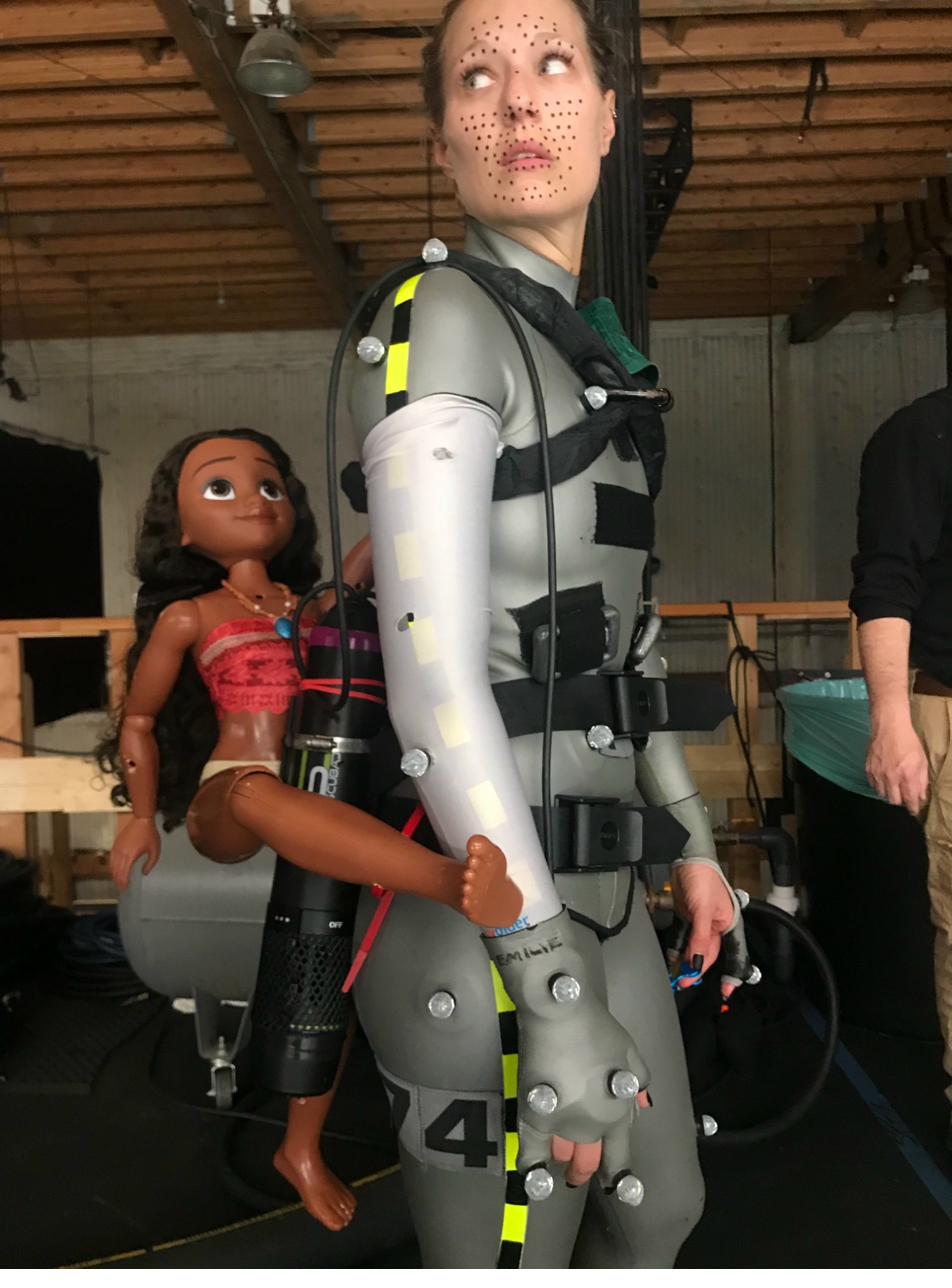 A stunt performer rigged up to play a whale