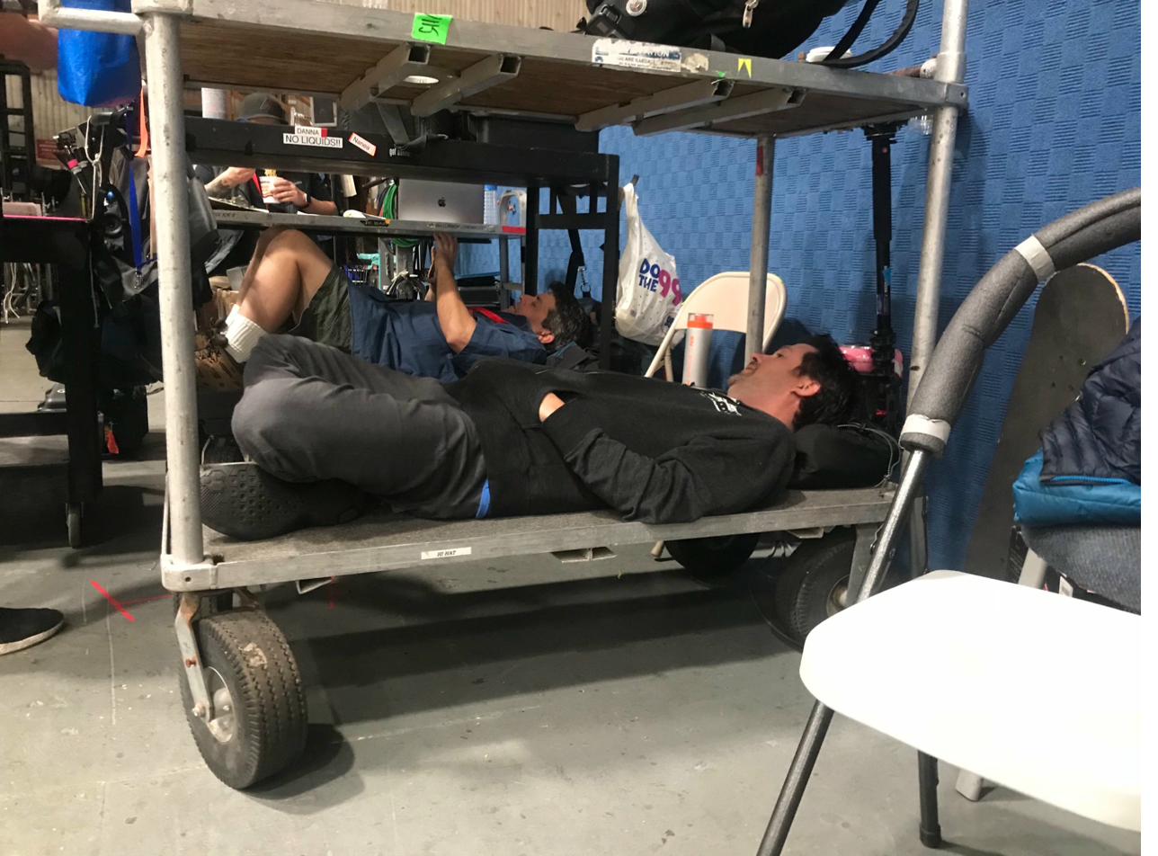 The camera team with Stephen Lang on the volume floor — virtual environment visible on the monitors behind them