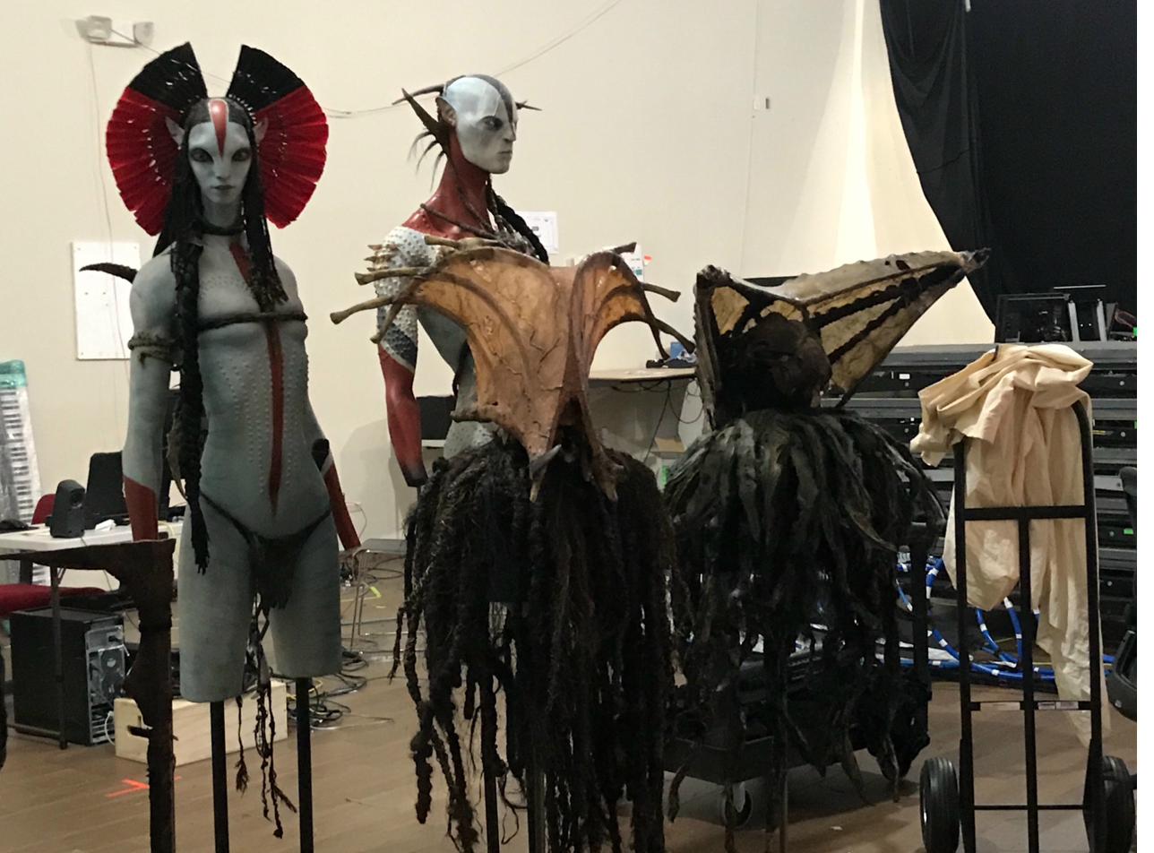Full-scale Na'vi costumes displayed on set