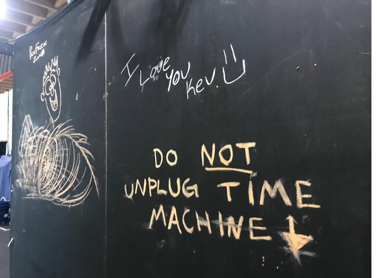 DO NOT UNPLUG TIME MACHINE chalk graffiti on the set wall