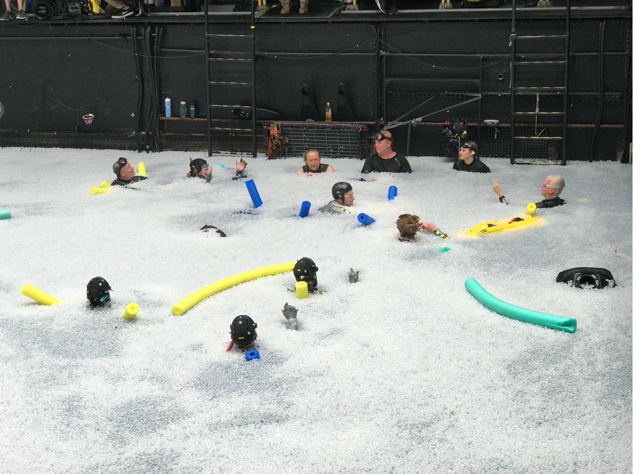 James Cameron in the ball pit tank with the stunt team