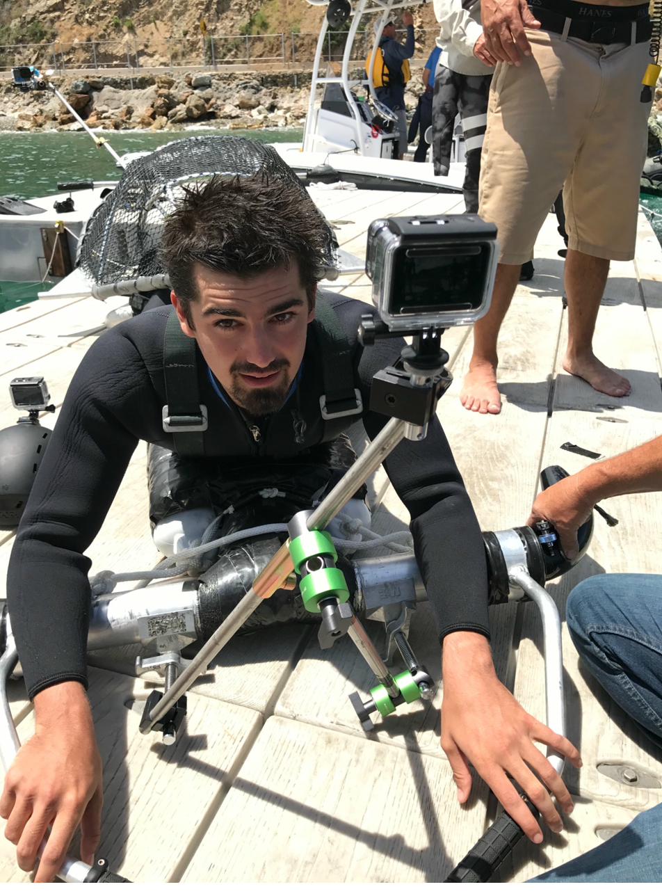 A stunt performer strapped into the Ilu sea creature rig with GoPro cameras mounted