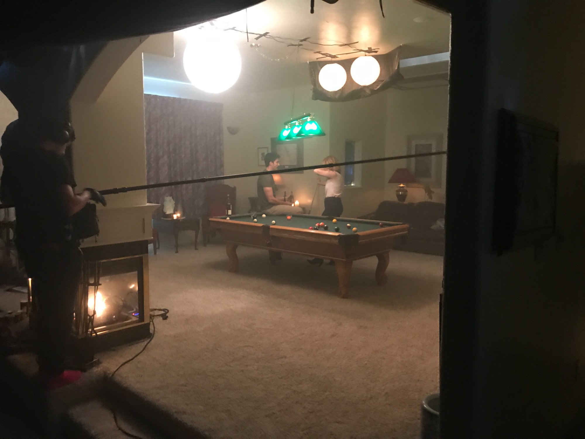 Shooting inside the blackout tent — pool table scene