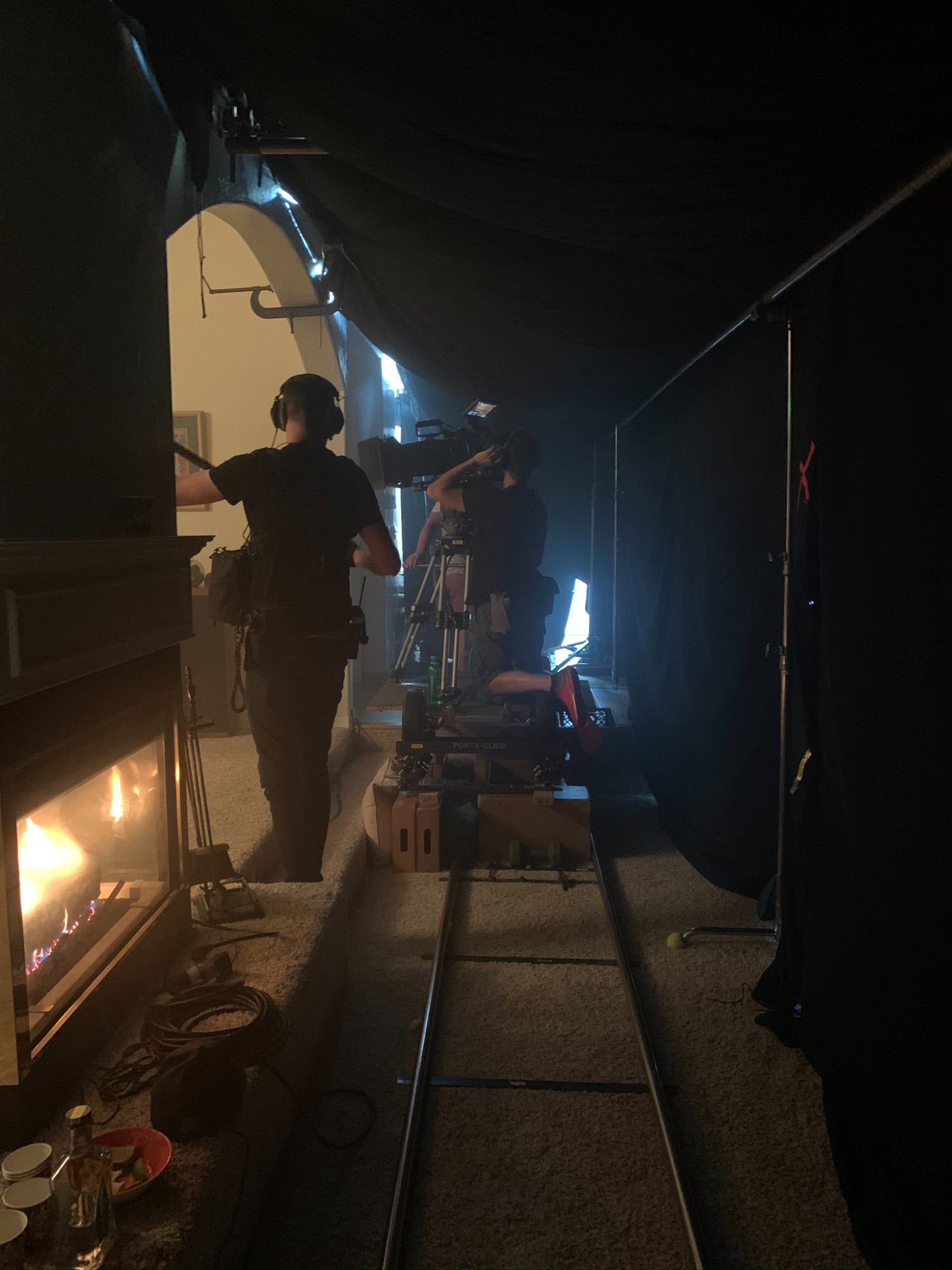 Dolly track running through the blackout tent inside the mansion