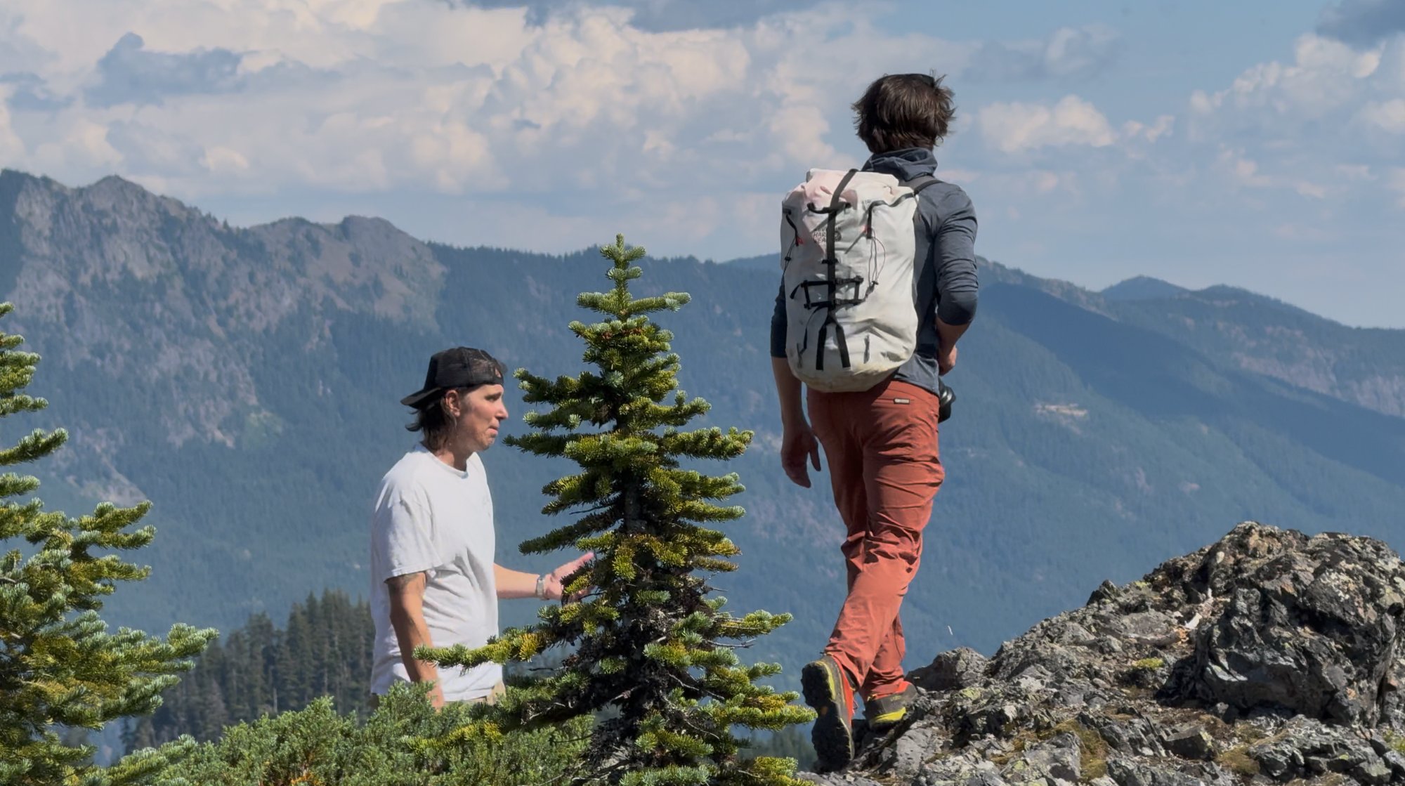 Nicholas Maggio directing on a mountain ridge in the Cascades