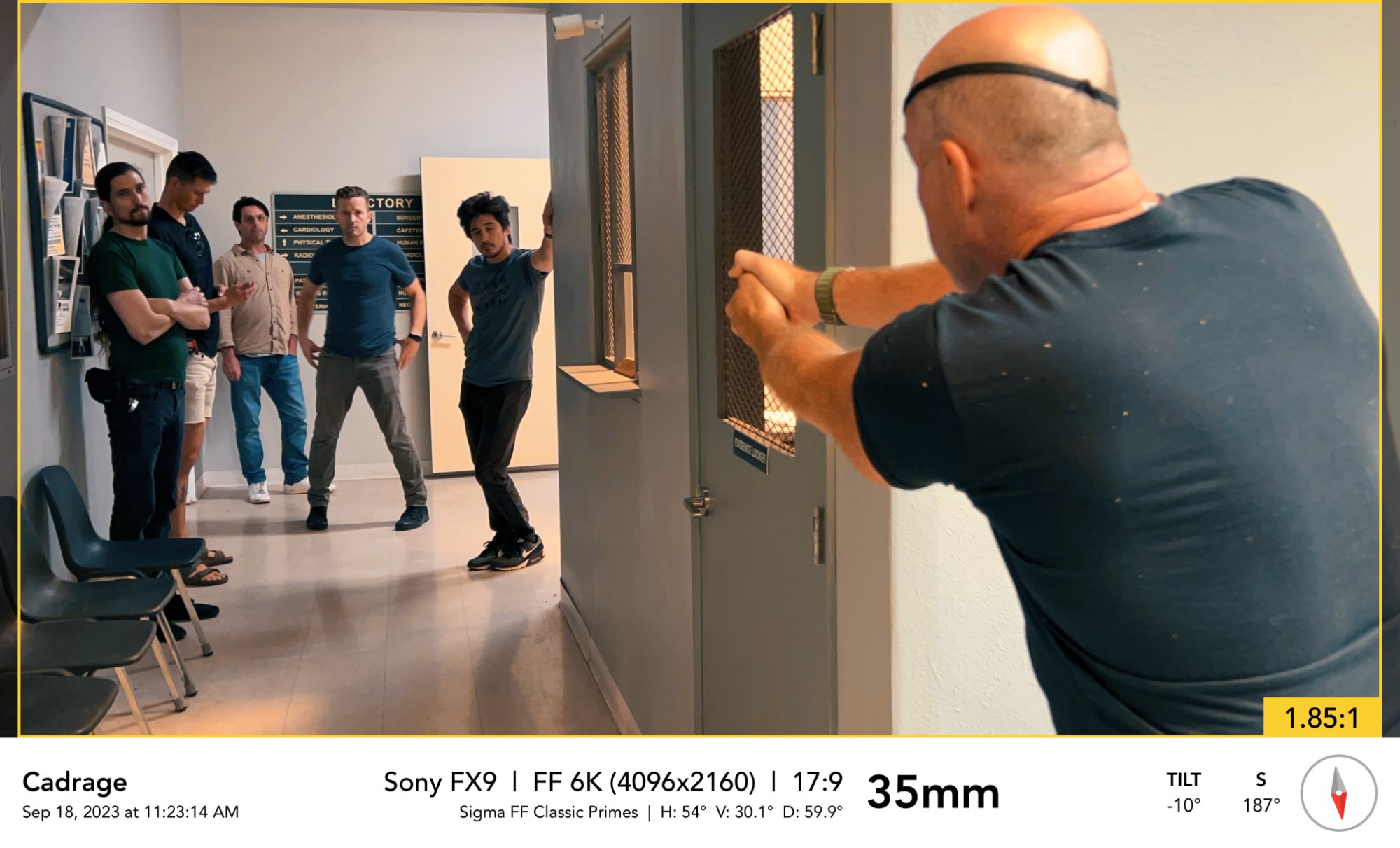 Scouting the hospital corridor — Garrett Warren directing the stunt team through the space