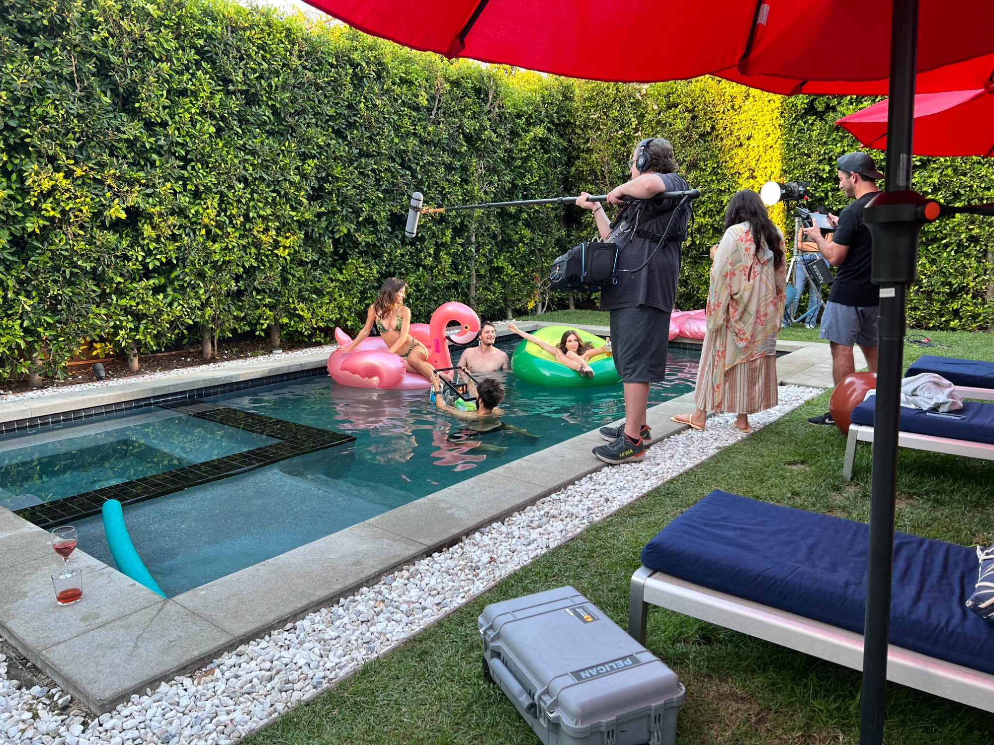Shooting the pool scene — camera operator in the water using a fish tank as an underwater housing